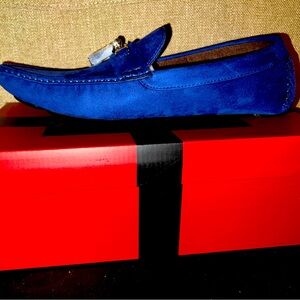 New Men’s blue loafers with silver accessories.